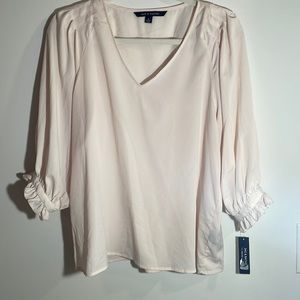 Medium blush color sheet top. Small spot in picture